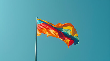 Vibrant Flag Waving Against Clear Blue Sky Celebrating Unity and Pride Under a Serene Sky