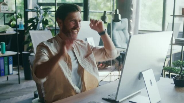 Happy Professional Typing at Desk in Modern Office and Stretching With Self-Satisfied Smile