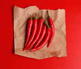red chili peppers on a red background
