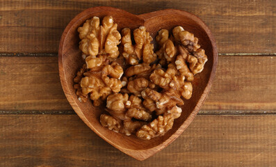 heart shaped bowl with walnuts