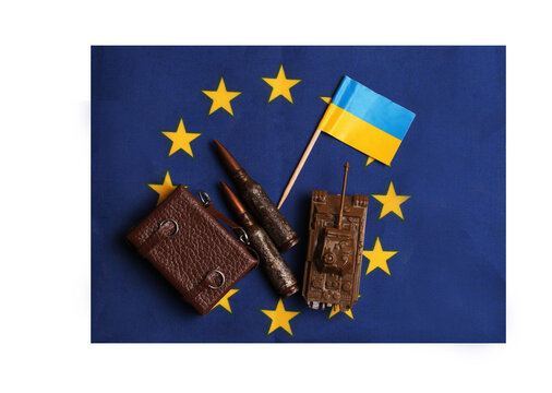 uitcase and cartridges with the flag of Ukraine on the background of the EU flag. Concept of the desire of the country to join the European Union