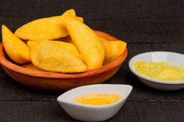 Colombian empanada with spicy sauce 