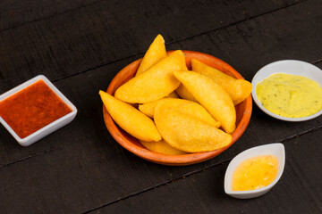 Delicious traditional Colombian empanadas with spicy sauce