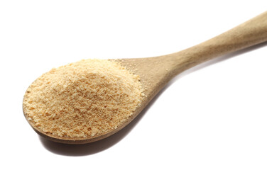 Pile biscuit crumbs in wooden spoon, isolated on white, side view