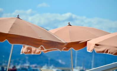 Beach umbrellas in Cannes, South of France on RIviera
