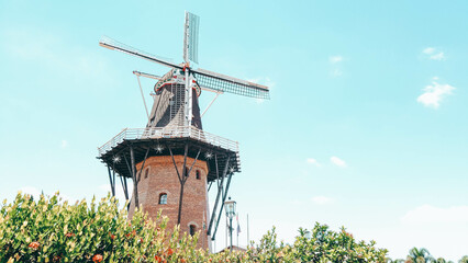 Dutch mill close-up on a beautiful summer day. The dutch mill is located in Holambra, Brazil, a charming city founded by the Dutch immigrants