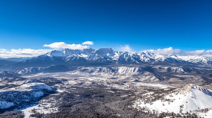 Fototapeta premium Majestic Winter Panorama: Snow-Capped Mountains and Valley