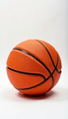 Obraz premium Close-up of orange basketball on white backdrop, competition, texture