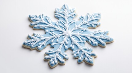 A 3D cookie in the form of a snowflake with precise detailing, frosted with icy blue icing, and placed against a white background