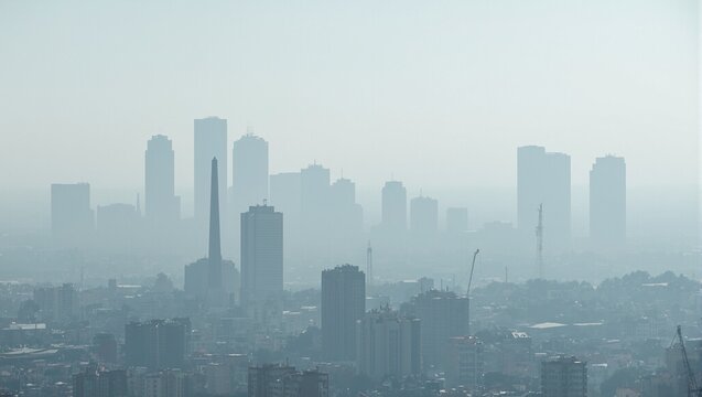 Urban skyline obscured by factory smog depicting air pollution
