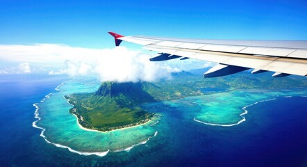 Obraz premium Photo of Island and Ocean from Airplane Window Near the Wing .