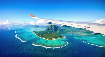 Obraz premium Photo of Island and Ocean from Airplane Window Near the Wing .