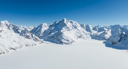 Snow-capped mountains under a bright blue sky create a refreshing and awe-inspiring natural scene, ideal for adventure visuals.
