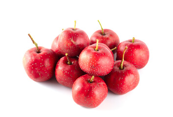 Several red hawthorns on a white background