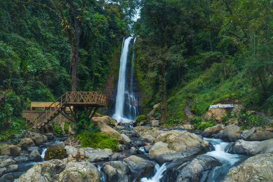 Gitgit waterfall with Balinese gate in Buleleng, Bali, Indonesia
