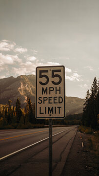 55 MPH Speed Limit Road Sign, Scenic Highway View, Mountain Landscape, Traffic Regulations, Road Safety Concept