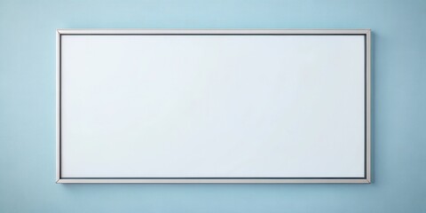 Blank white rectangular frame on a pale blue wall ideal for showcasing artwork or design
