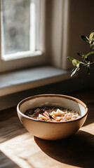 A bowl of oatmeal topped with brown sugar and cinnamon