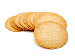 A close-up image of baked potato crisps isolated on a white background. Showcasing their golden-brown texture and thin