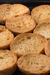 close-up of freshly baked butter biscuits, round and flat classic treat with buttery flavor and crisp texture, soft focus with background