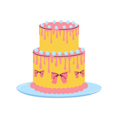 Colorful two-tier cake with icing and decorative bows on a blue plate