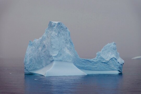 Fascinating Antarctica with a beautiful iceberg mountain covered with snow and ice in arctic see