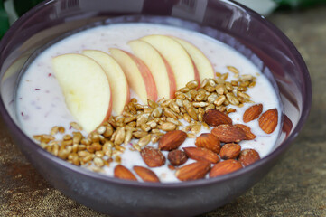 smoothie bowl , strawberry smoothie or strawberry yogurt with apple , sunflower seed and almond