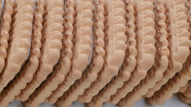 Stack of sandwich biscuits with chocolate. Macro details. Slider shot. Desserts, snacks, treats, sweets concepts. 4k