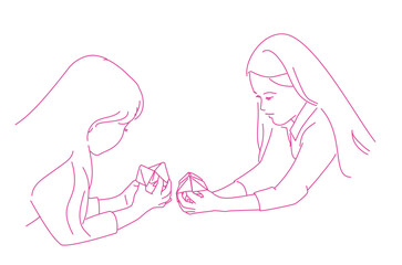 Two girls playing origami fortune game