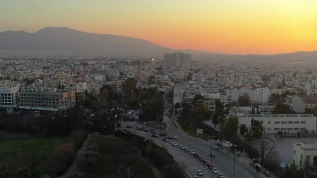 Drone shot of Marousi in Athens, Greece with traffic at sunset