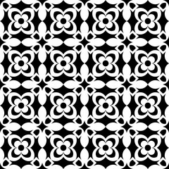 Fototapeta premium Seamless black and white geometric pattern, featuring a symmetrical design with floral motifs. Suitable for backgrounds, wallpapers, textiles, fabrics and various creative projects.