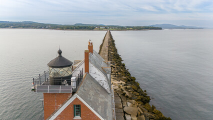 Rockland Breakwater Lighthouse cutting through the harbor on the Gulf of Maine 
