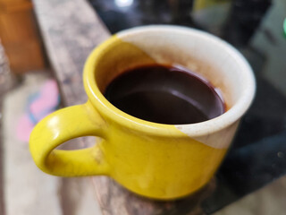Classic Coffee Cup Black Coffee on Table and Natural blur Background.