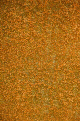 Closeup rust detail in bright orange, as a textured oxidized metal abstract background
