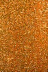 Closeup rust detail in bright orange, as a textured oxidized metal abstract background
