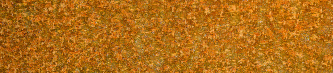 Closeup rust detail in bright orange, as a textured oxidized metal abstract background
