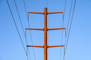 Closeup of upgraded to 230 kV overhead power line distribution system, high-tension power lines on...