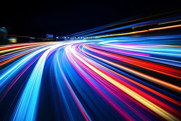 Abstract light trails of speeding vehicles at night.