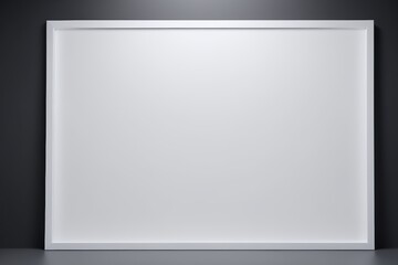 blank white picture frame on a wall with a spotlight