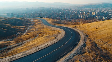 Panoramic View of a Curved Empty Road on a Hilltop Landscape