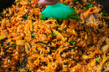 stir-fried rice with spicy sauce after eating streamed seafood