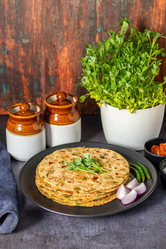Methi paratha is a savory Indian flatbread made with fenugreek leaves, whole wheat flour, spices, and ghee, offering a flavorful, aromatic, and nutritious meal.