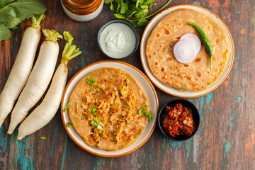 Mooli paratha is a stuffed Indian flatbread made with grated radish, whole wheat flour, and spices, offering a flavorful, nutritious, and wholesome meal.