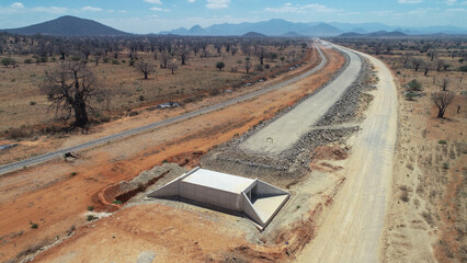 Concrete Culvert Installation Under Dirt Road Construction
