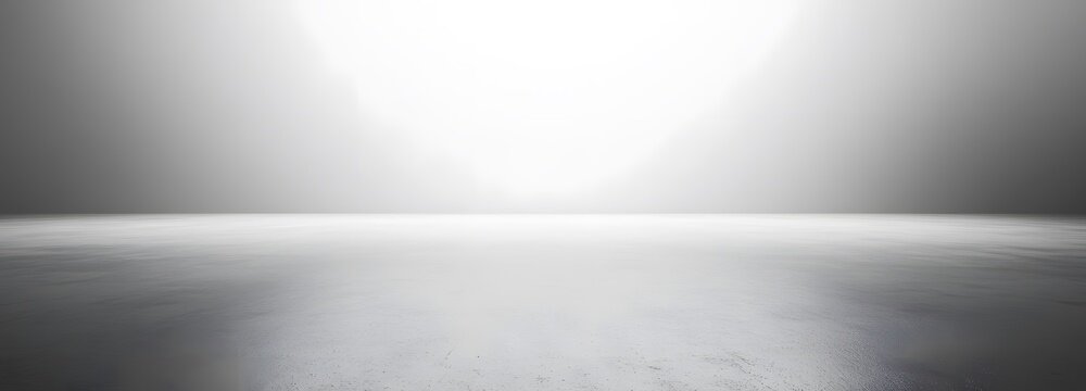 A vast empty room with a pale gray backdrop, offering a neutral, sleek environment for product presentation