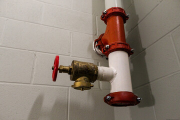 fire hose standpipe system strategy in stairwell with concrete wall background fire safety...