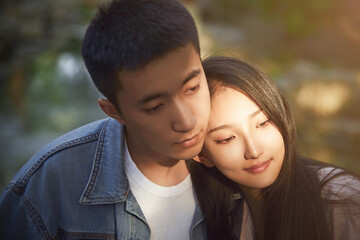 Fototapeta premium Loving young couple outdoors at sunset