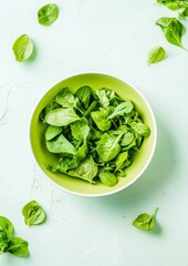 Obraz premium Fresh Green Vegetable Bowl on Light Background – Modern Minimalist Salad Concept