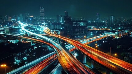 Obraz premium Illuminated Industrial Complex at Night with Strategic City Lights