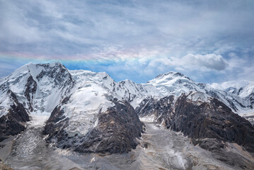 Obraz premium Tien shan mountains with rainbow